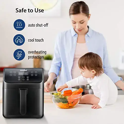 woman and her baby boy eating vegetables from a bowl next to a comfee digital air fryer
