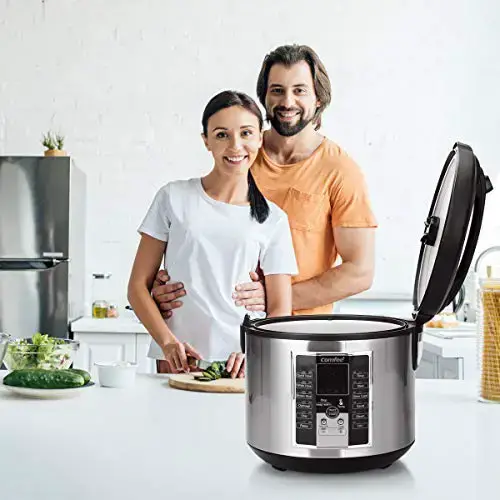 caucasian man and woman standing in a modern kitchen with a comfee rice cooker on the countertop