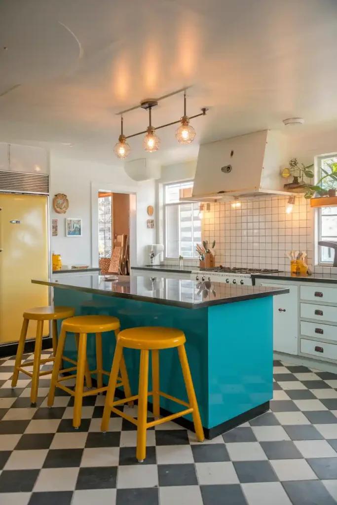 a vibrant kitchen space with a retro flair, highlighting a bright-colored kitchen island and matching stools in bold hues like teal or mustard yellow.