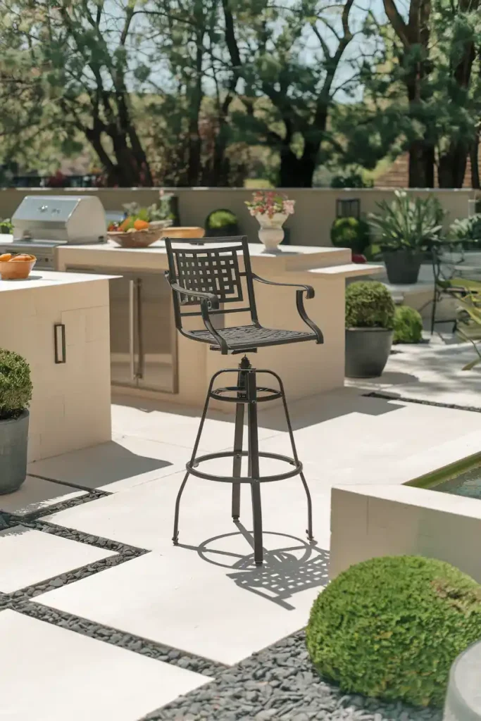 a sturdy outdoor bar stool set on a stylish patio with a kitchen island nearby. Include garden elements and sunny weather, emphasizing the durability and outdoor leisure.