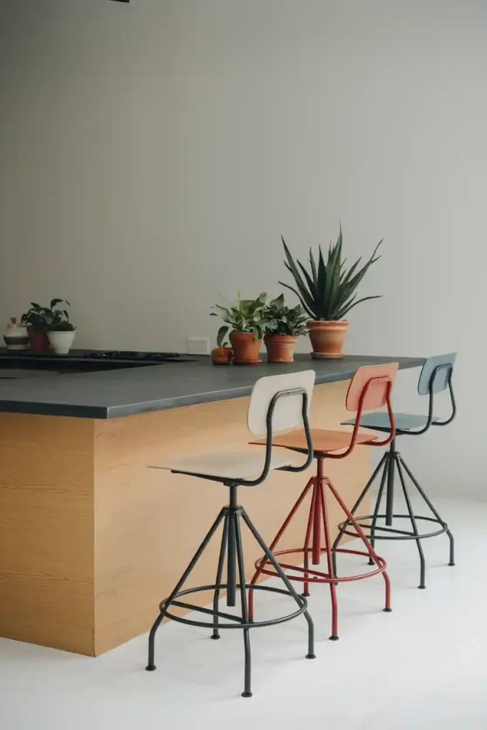 Minimalist Swivel Stools: A minimalist kitchen island adorned with simple yet elegant swivel back stools, focusing on clean lines and neutral colors for a sophisticated look.