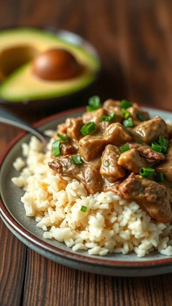 A delicious serving of Beef Stroganoff over avocado rice, garnished with green onions.