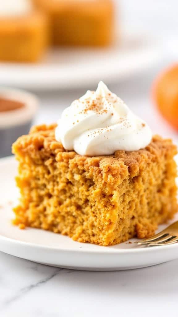 Slice of Pumpkin and Angel Food Crunch Cake with whipped cream and cinnamon on a plate