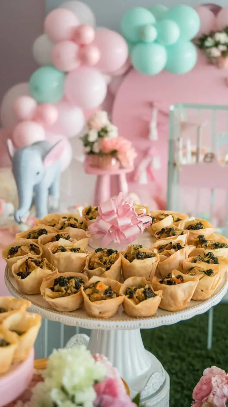 A platter of spinach and artichoke phyllo cups surrounded by festive decorations.